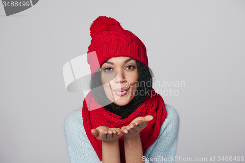 Image of Winter girl blowing a kiss