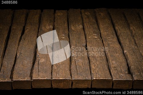 Image of Wooden top and dark space 