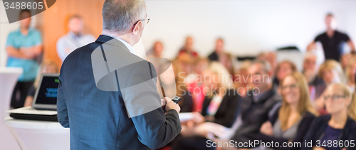 Image of Speaker at Business Conference and Presentation.