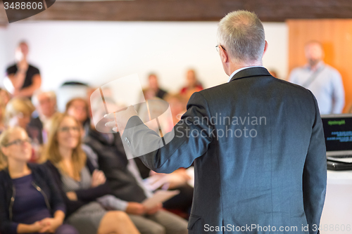 Image of Speaker at Business Conference and Presentation.