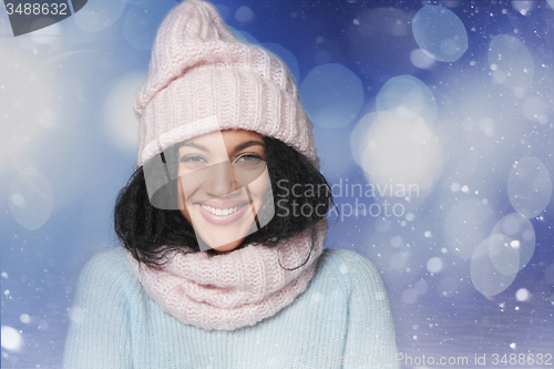 Image of Laughing mixed race winter woman