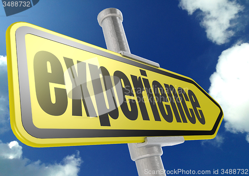 Image of Yellow road sign with experience word under blue sky