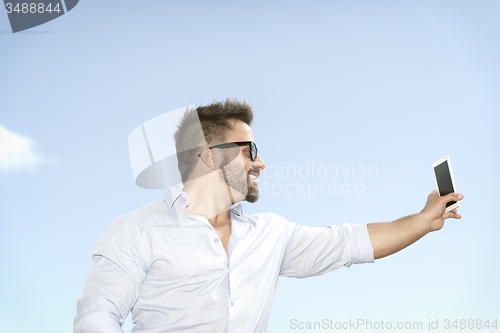 Image of man taking selfie