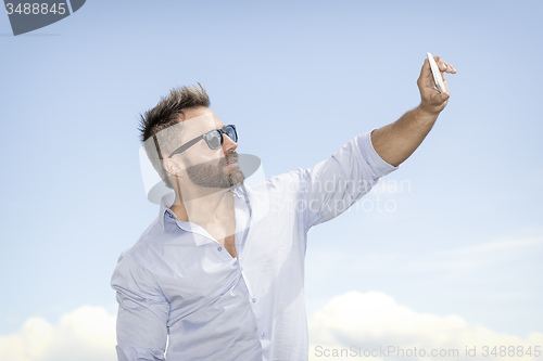 Image of man taking selfie