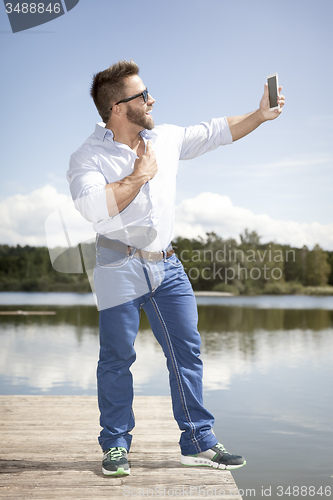 Image of man taking selfie