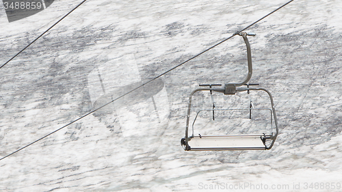 Image of Empty ski lift above snow