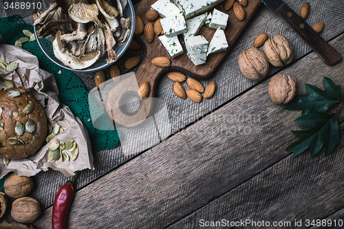 Image of nuts mushrooms, cheese and bread buns for healthy lunch 