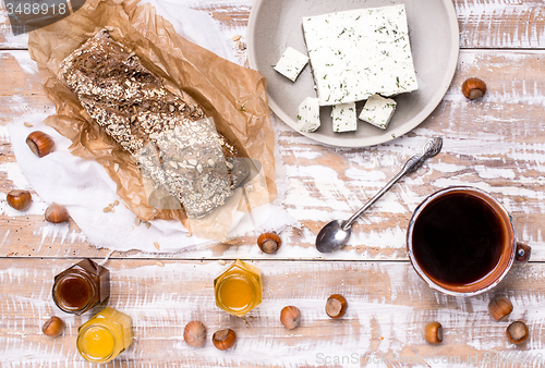 Image of Morning tea Bread with seeds huzelnuts and cheese on board