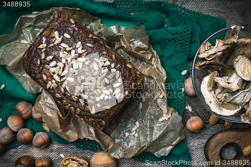 Image of Closeup of bread with seeds, nuts and mushrooms