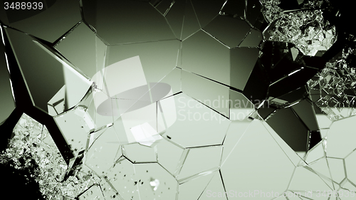 Image of Pieces of splitted or cracked glass on black