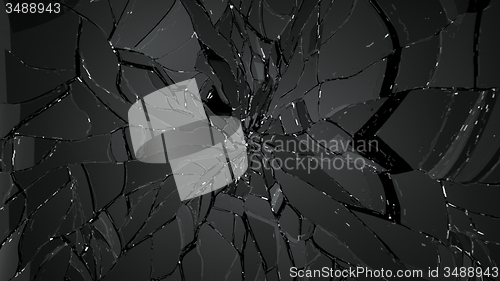 Image of Pieces of splitted or broken glass on black