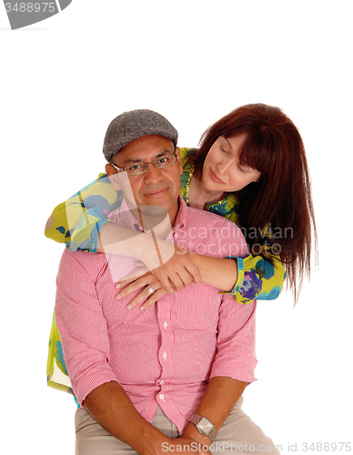 Image of Caucasian wife hugging her man.