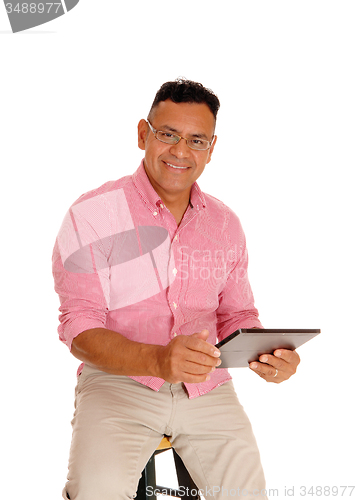 Image of Man working with his tablet computer.