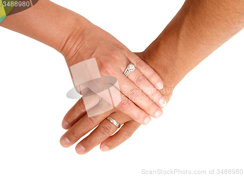 Image of The hand of a man and woman.