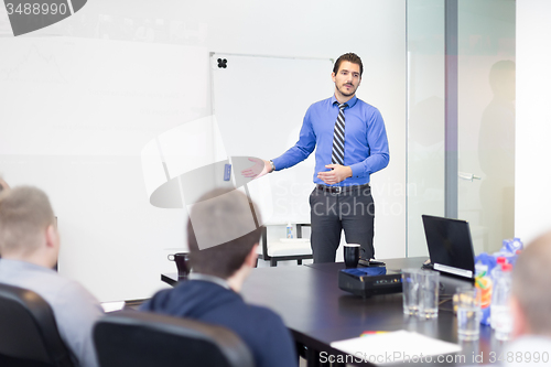 Image of Business man making a presentation in office on job interview. 