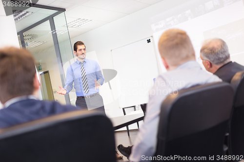 Image of Business man making presentation in office on job interview. 