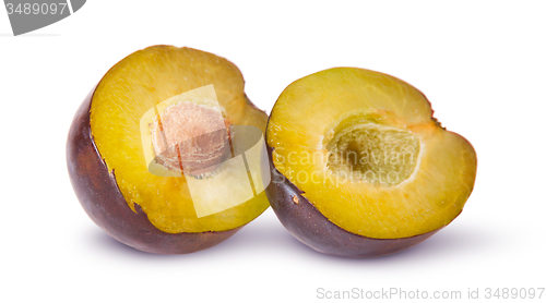 Image of Two halves of violet plums near