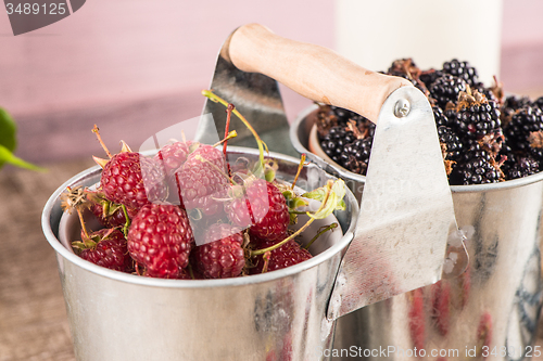 Image of Metal buckets with fresh berries