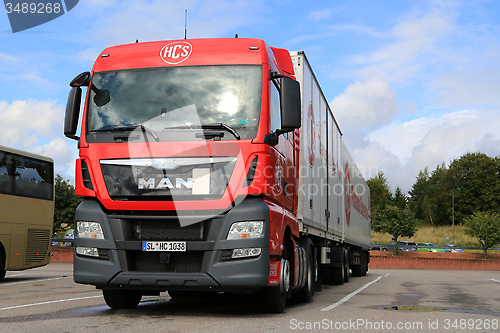 Image of Red MAN TGX 26.480 Truck and Full Trailer Parked