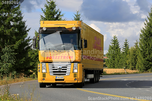 Image of Yellow Renault Magnum Semi Truck on the Road