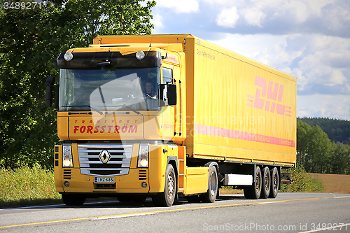 Image of Yellow Renault Magnum Semi Truck on the Road