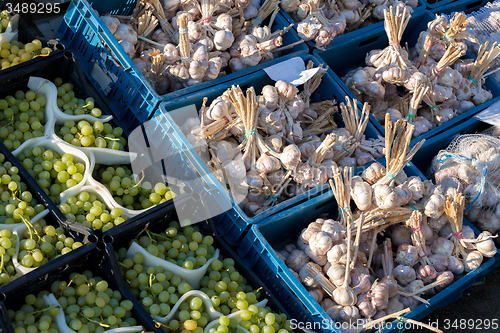 Image of fresh garlic and grapes in a market