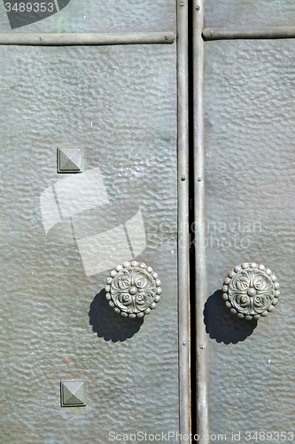 Image of  varese    knocker in a  door curch  closed  italy  sumirago