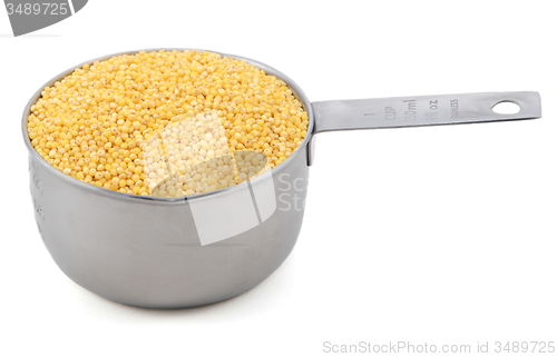 Image of Millet grains in a measuring cup