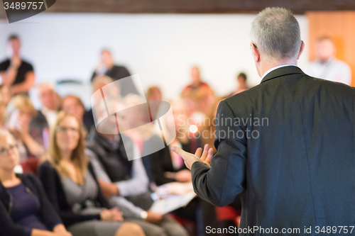 Image of Speaker at Business Conference and Presentation.