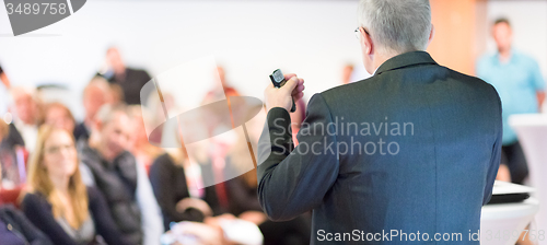 Image of Speaker at Business Conference and Presentation.