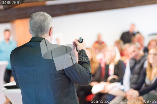 Image of Speaker at Business Conference and Presentation.