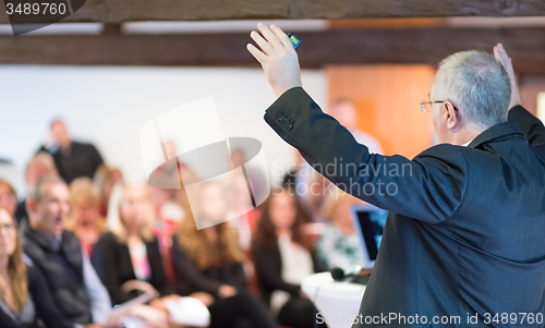 Image of Speaker at Business Conference and Presentation.