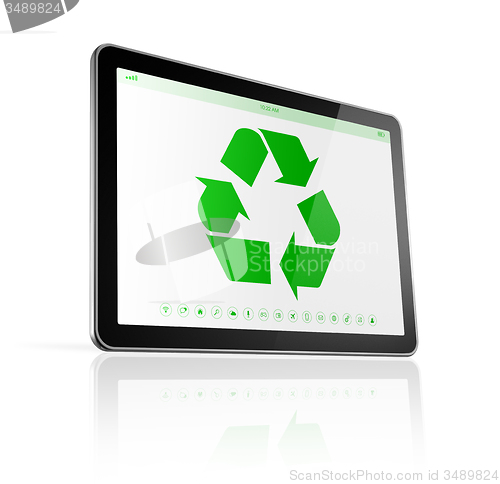 Image of Digital tablet PC with a recycle symbol on screen. environmental