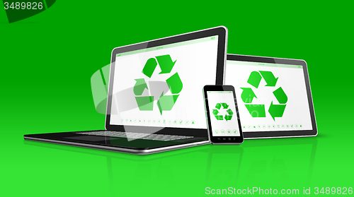 Image of Laptop tablet PC and smartphone with a recycle symbol on screen.