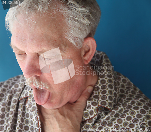 Image of ill senior man coughing