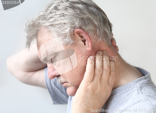 Image of Senior man with sore neck