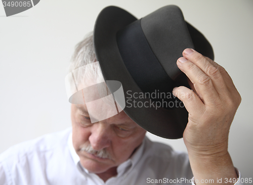 Image of Senior man with hat