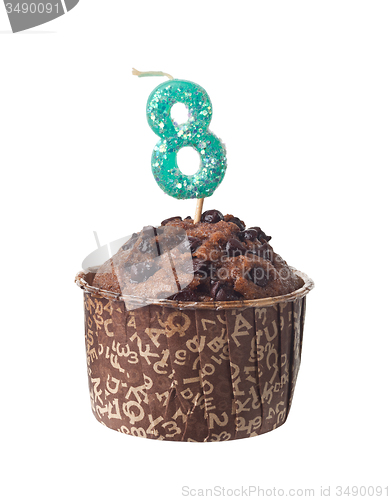 Image of Chocolate muffin with birthday candle for eight year old