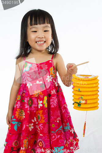 Image of Chinese little girl holding latern