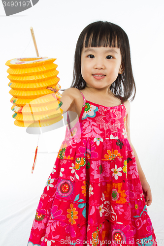 Image of Chinese little girl holding latern