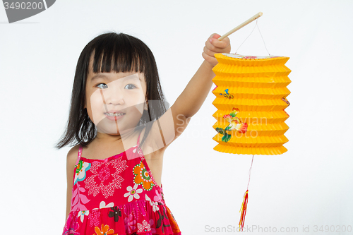 Image of Chinese little girl holding latern