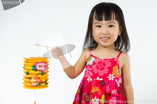 Image of Chinese little girl holding latern