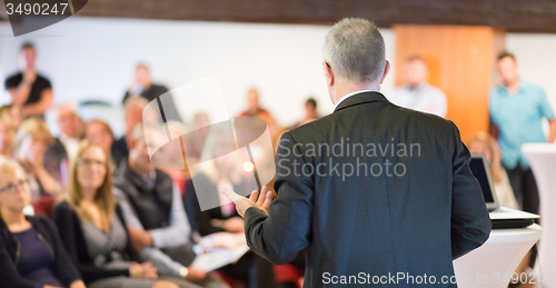 Image of Speaker at Business Conference and Presentation.