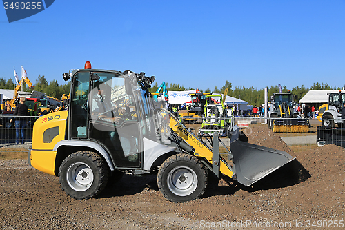 Image of Kramer Allrad 350 Wheel Loader Moves Gravel