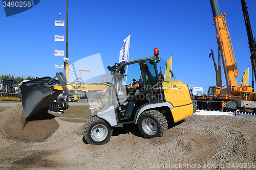 Image of Kramer Allrad 350 Wheel Loader Unloads Gravel