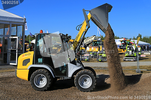 Image of Kramer Allrad 350 Wheel Loader Unloads Gravel