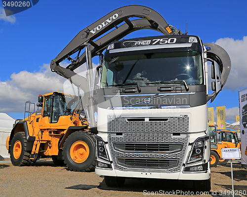 Image of Volvo FH16 750 Truck and Wheel Loader with Log Grapples