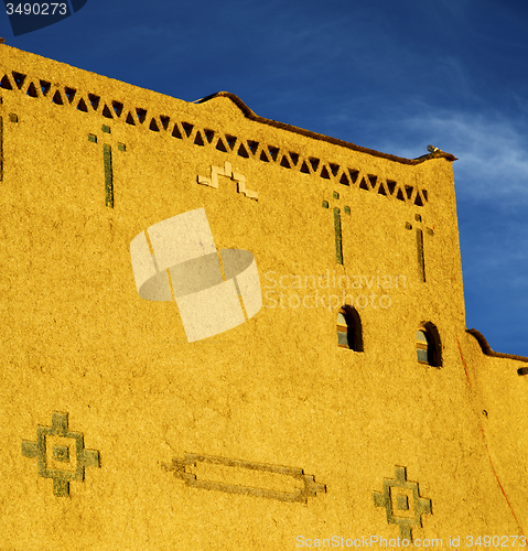 Image of old brown construction in africa morocco and sky  near the tower