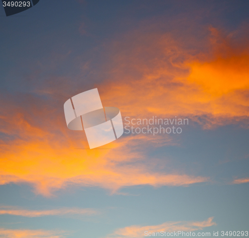 Image of the sunrise in  colored sky white soft clouds and abstract backg