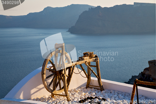 Image of greece in   sea and spinning wheel